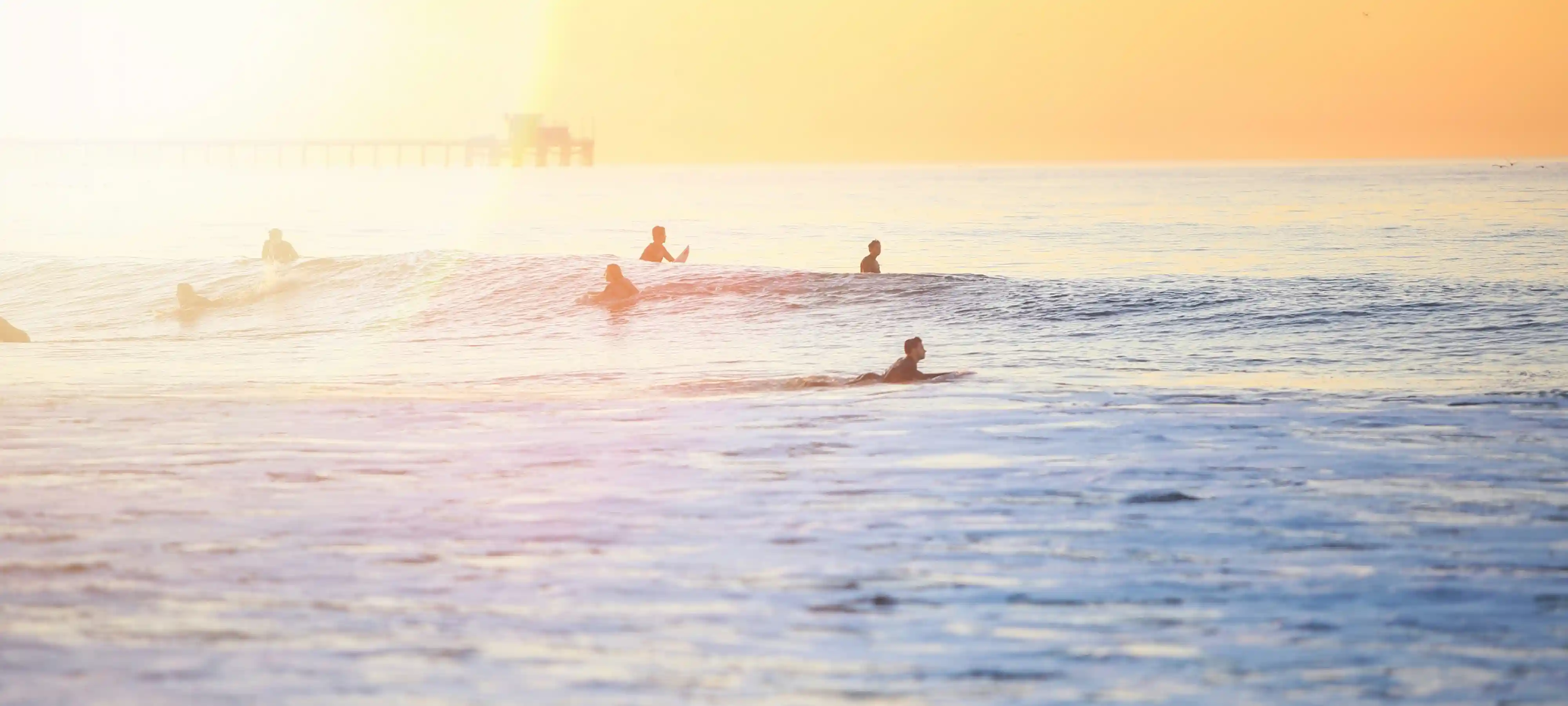 Surfers in water background